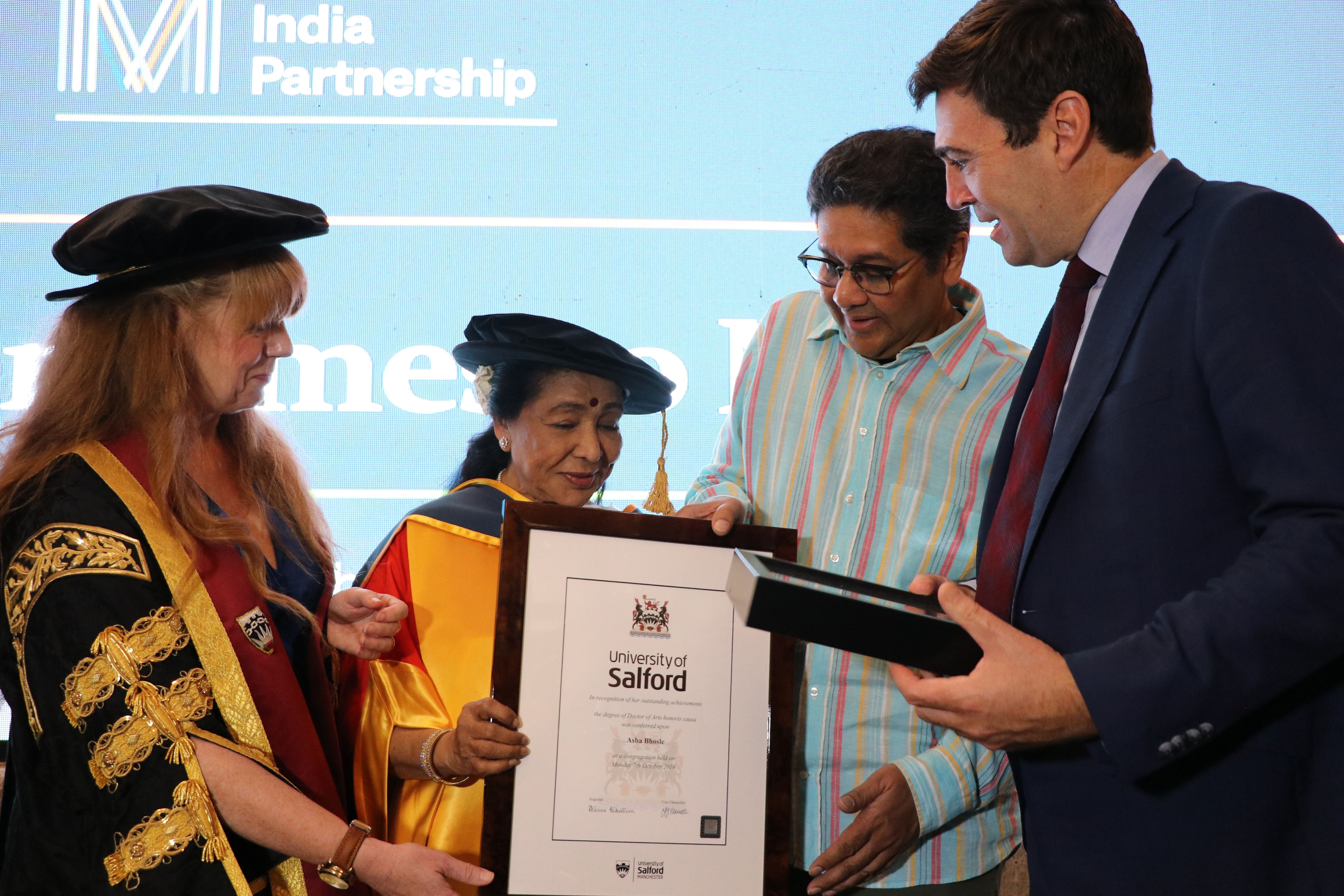 L-R Jo Purves, Pro Vice-Chancellor International and Regional Partnership, University of Salford, Asha Bhosle, Anand Bhosle, Andy Burnham, Mayor of Manchester